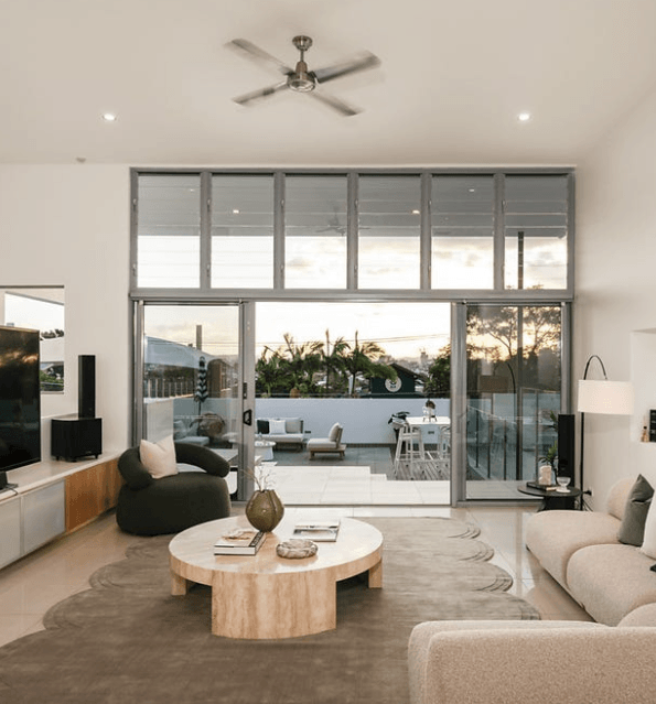 Happy customer of Intent Building Contracting writing a testimonial inside their renovated home